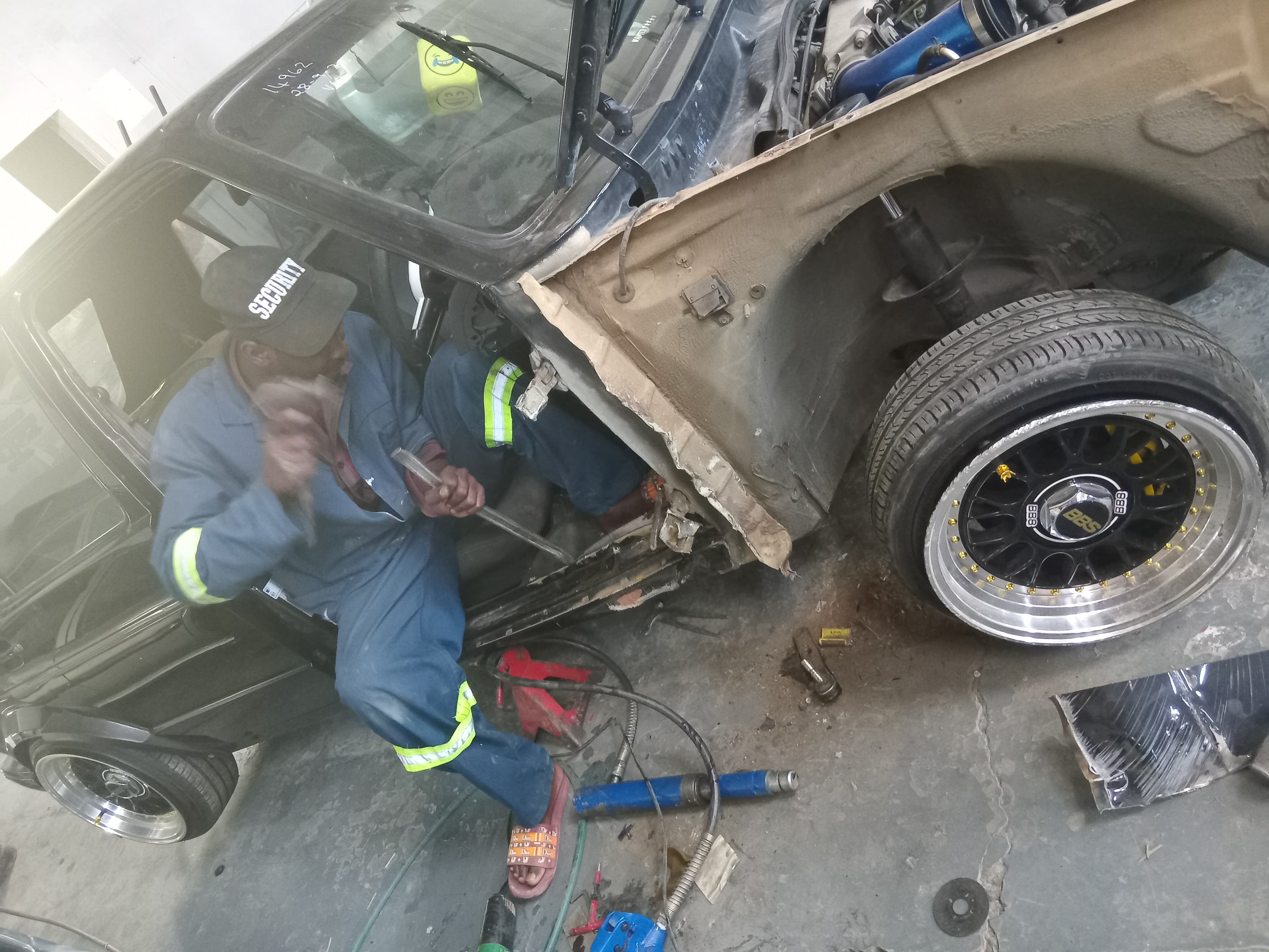 Tammag technician carrying out body repair work on a vehicle