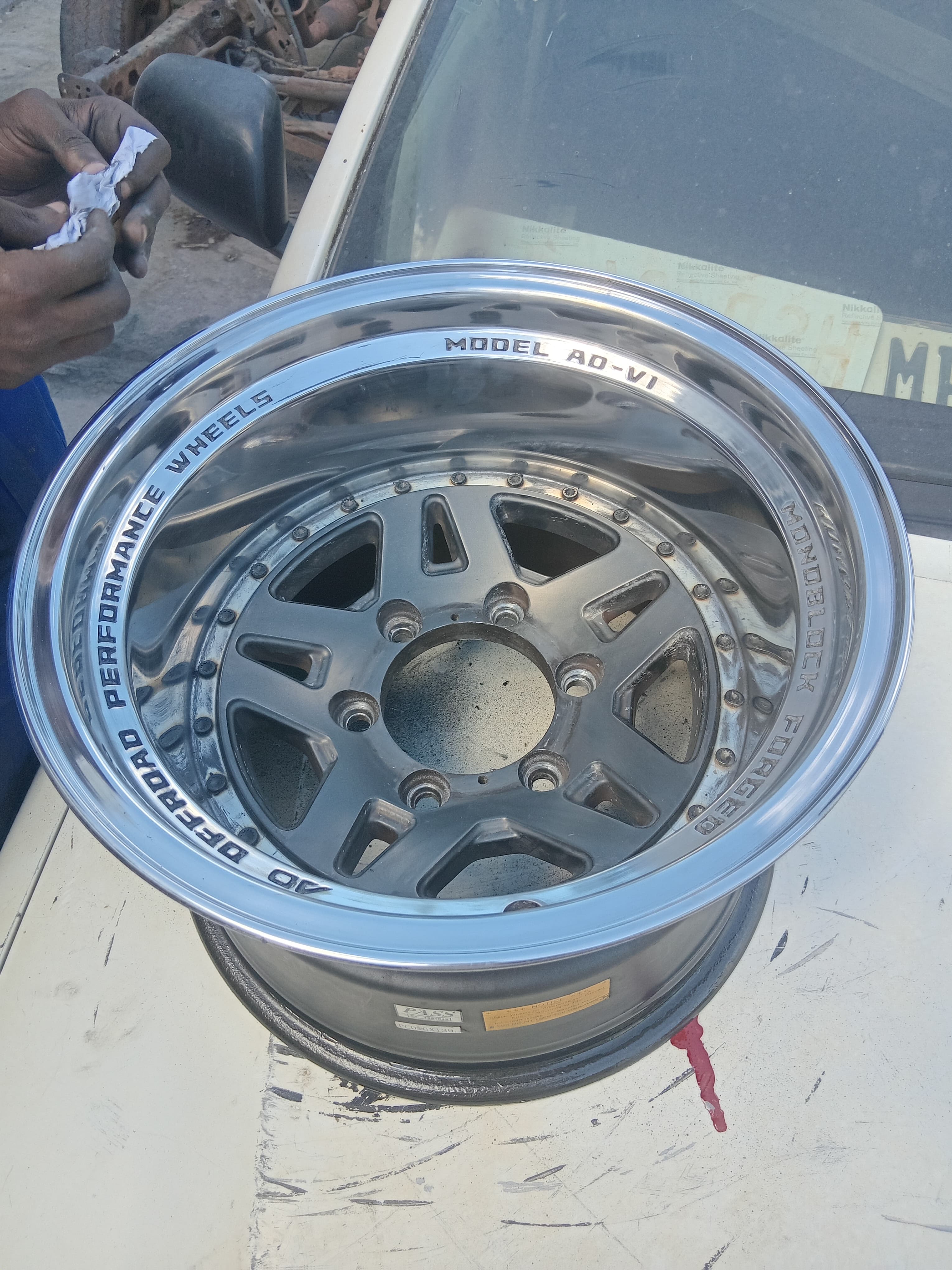 Polished aluminium mag wheel with a restored reflective rim
