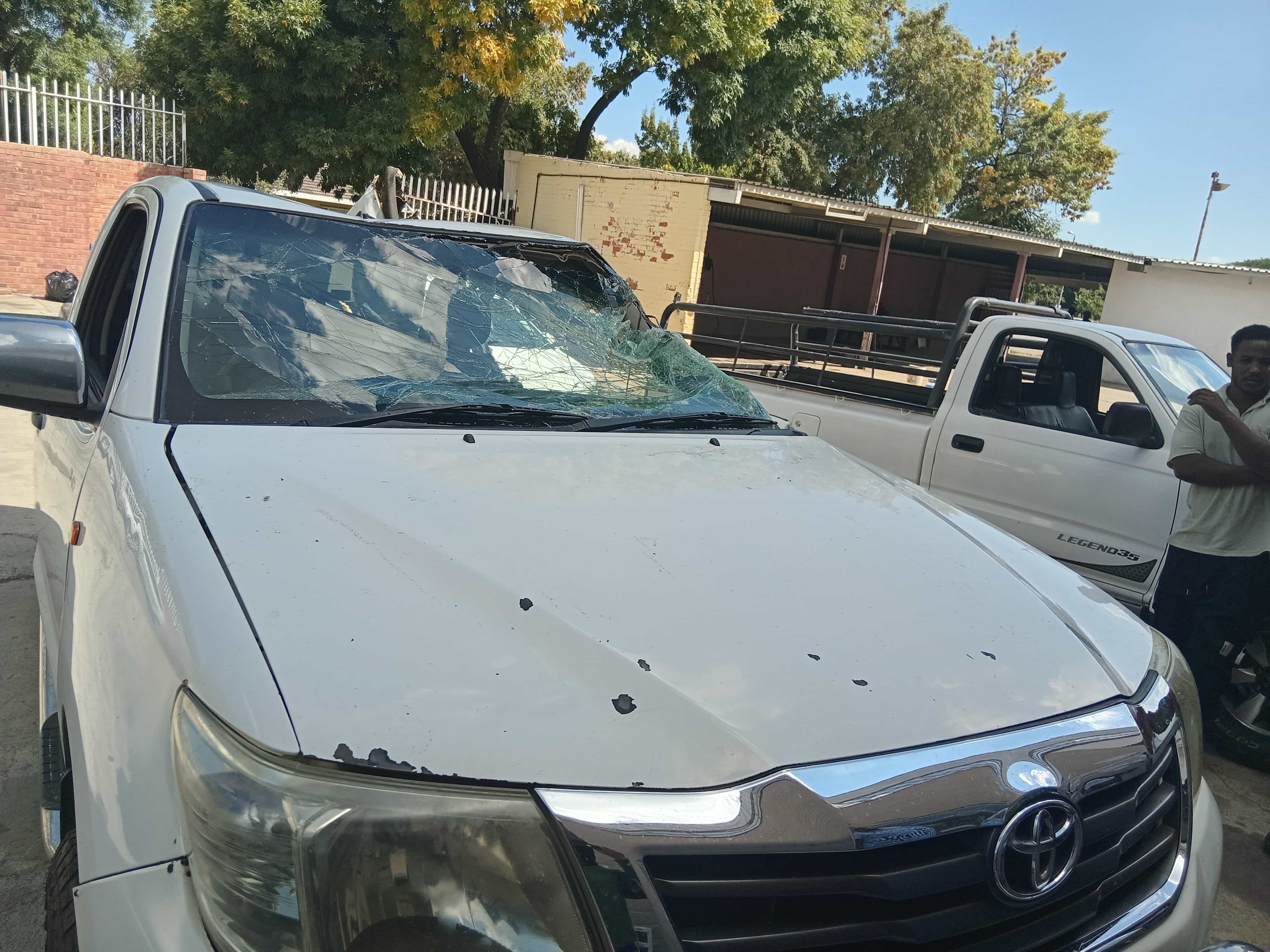 Pickup with damaged roof and windscreen ready for assessment