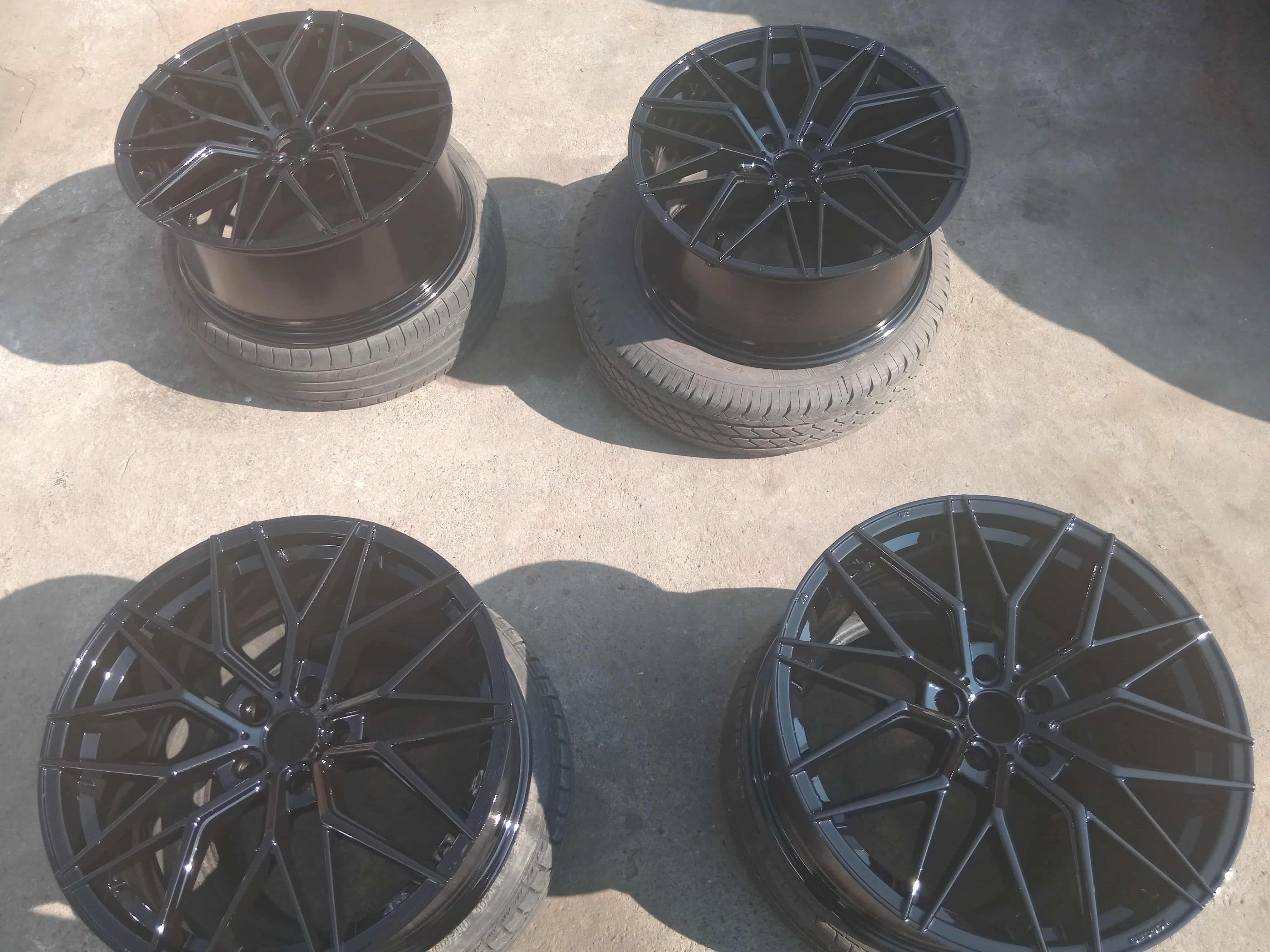 Four freshly painted black mag wheels completed by Tammag