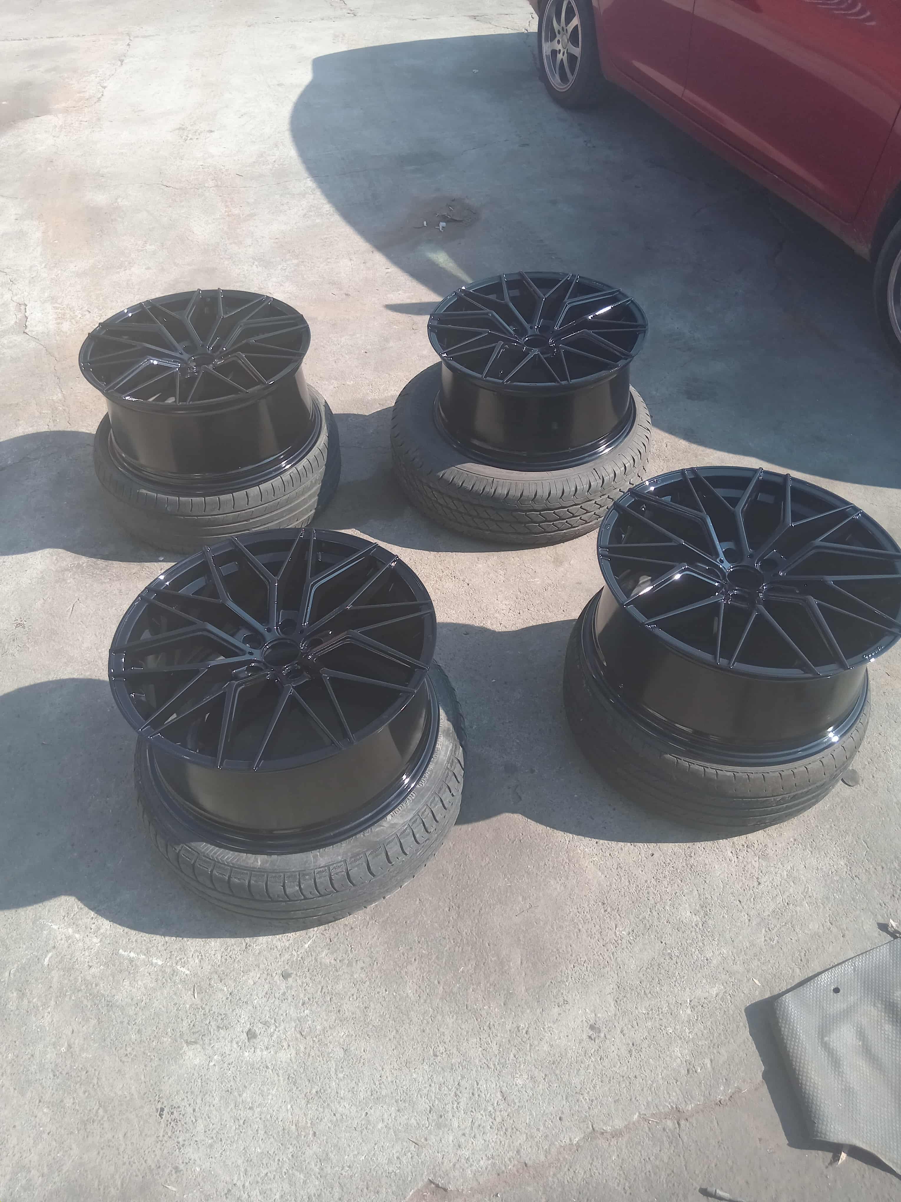 Set of four black mag wheels after professional painting